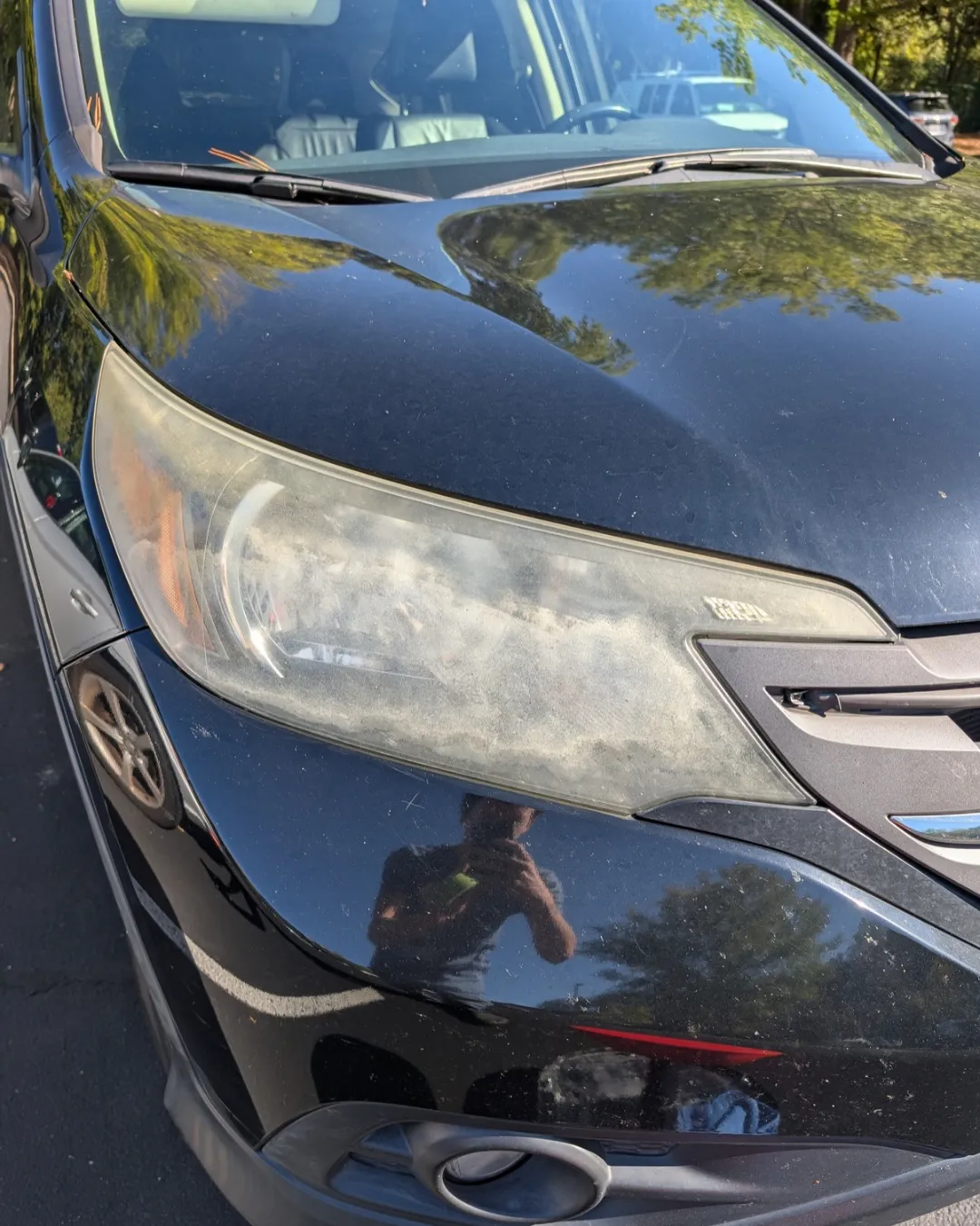 Foggy, oxidized Honda headlight before restoration
